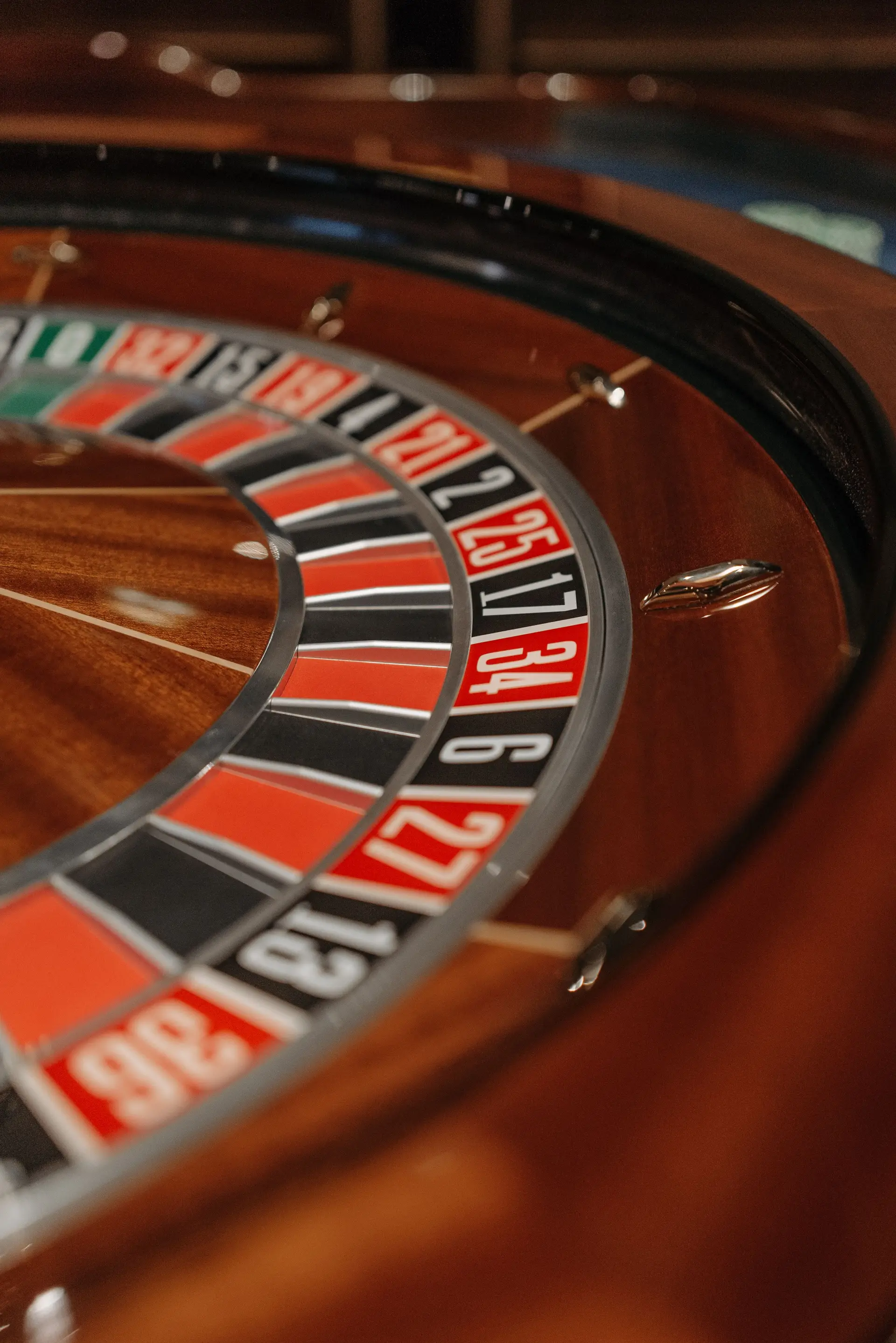 Detailed close-up of a roulette wheel in a casino