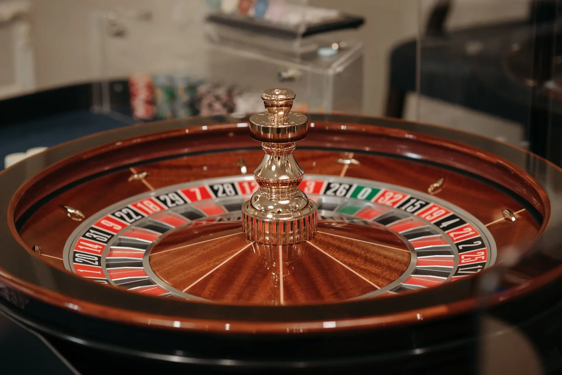 Close-up of a classic roulette wheel in a casino setting