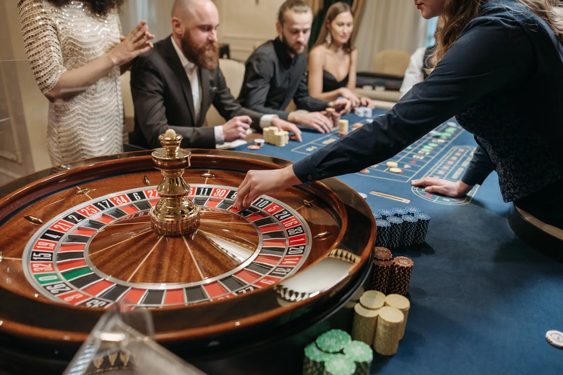 A vibrant casino scene shows players and a dealer engaging in a game