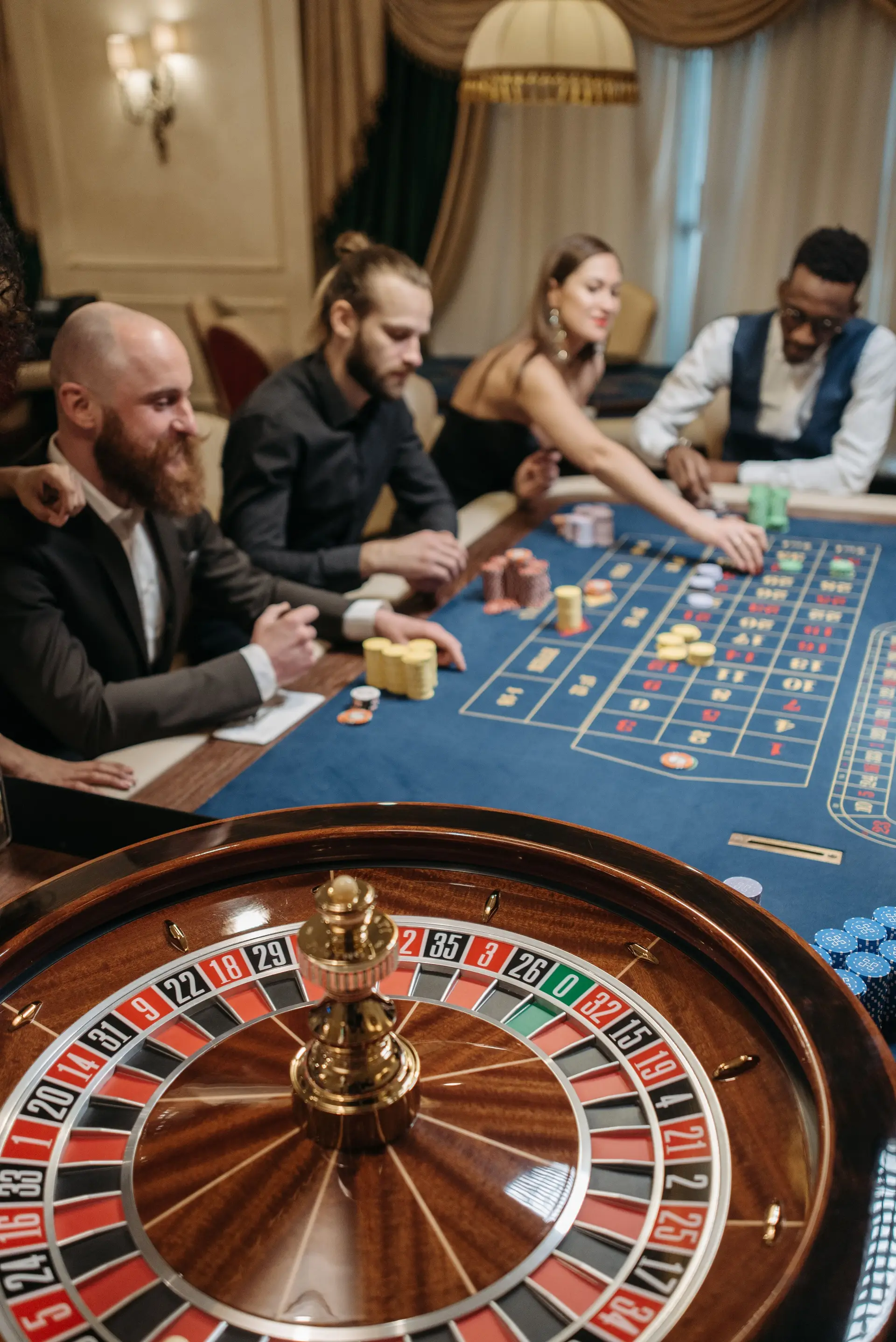 Group of diverse people enjoying a thrilling game of roulette